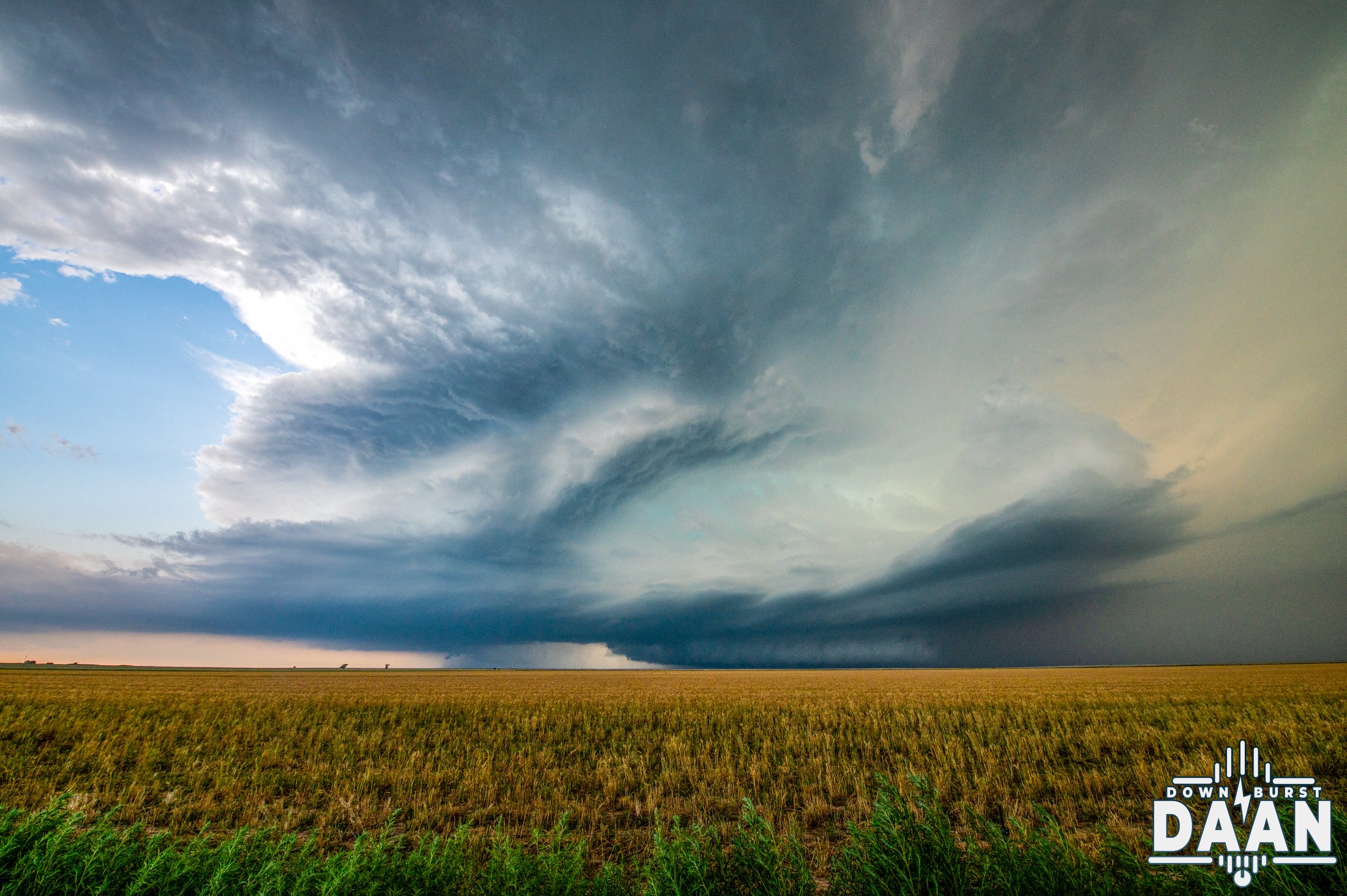 Rotating supercell with a striated updraft over golden Plains farmland